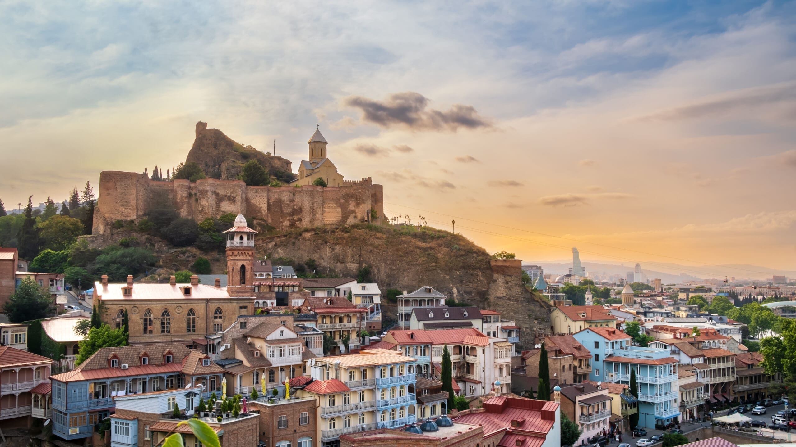 Old Tbilisi, Georgia with Narikala Fortress and Saint Nicholas's Orthodox Church, Jumah Mosque and sulfur baths district at sunset. Tiflis ancient architecture, popular tourist destination Туры в Грузию с IBG Travel